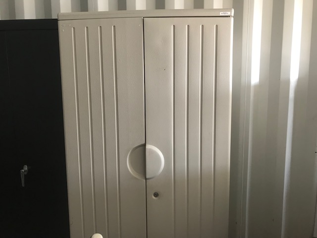Tall cream colored storage cabinet 1.1